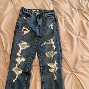 A pair of ripped jeans from american eagle
